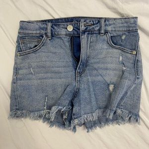 Medium wash short jeans.